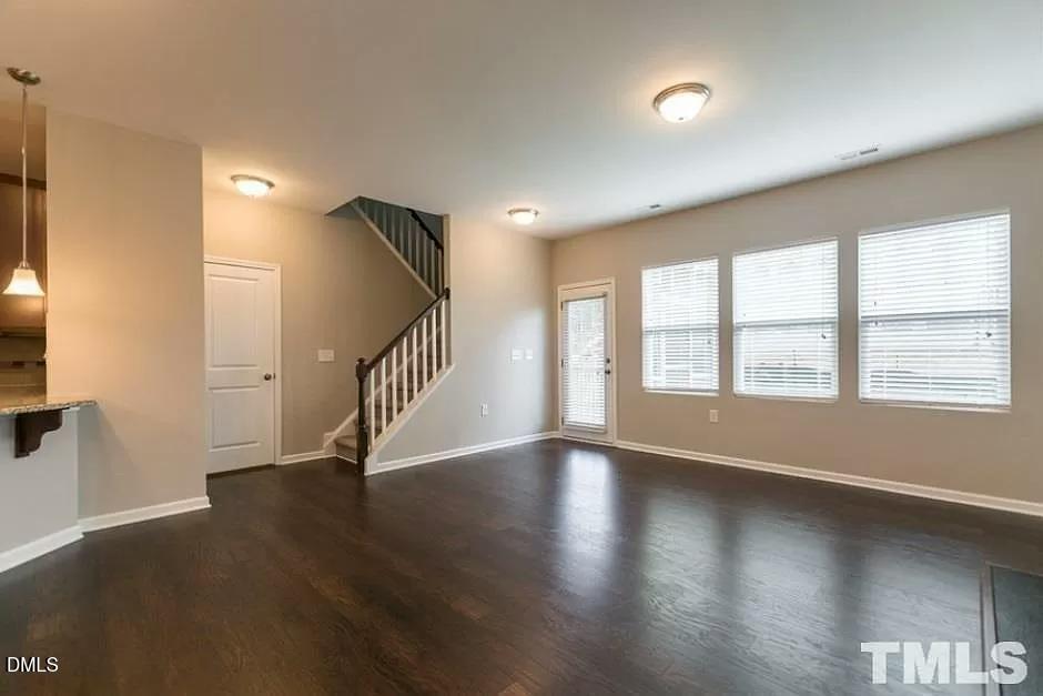 1142 Lookout Ridge Road Apex, NC 27502 - Photo 9 of 21 a view of an entryway with wooden floor