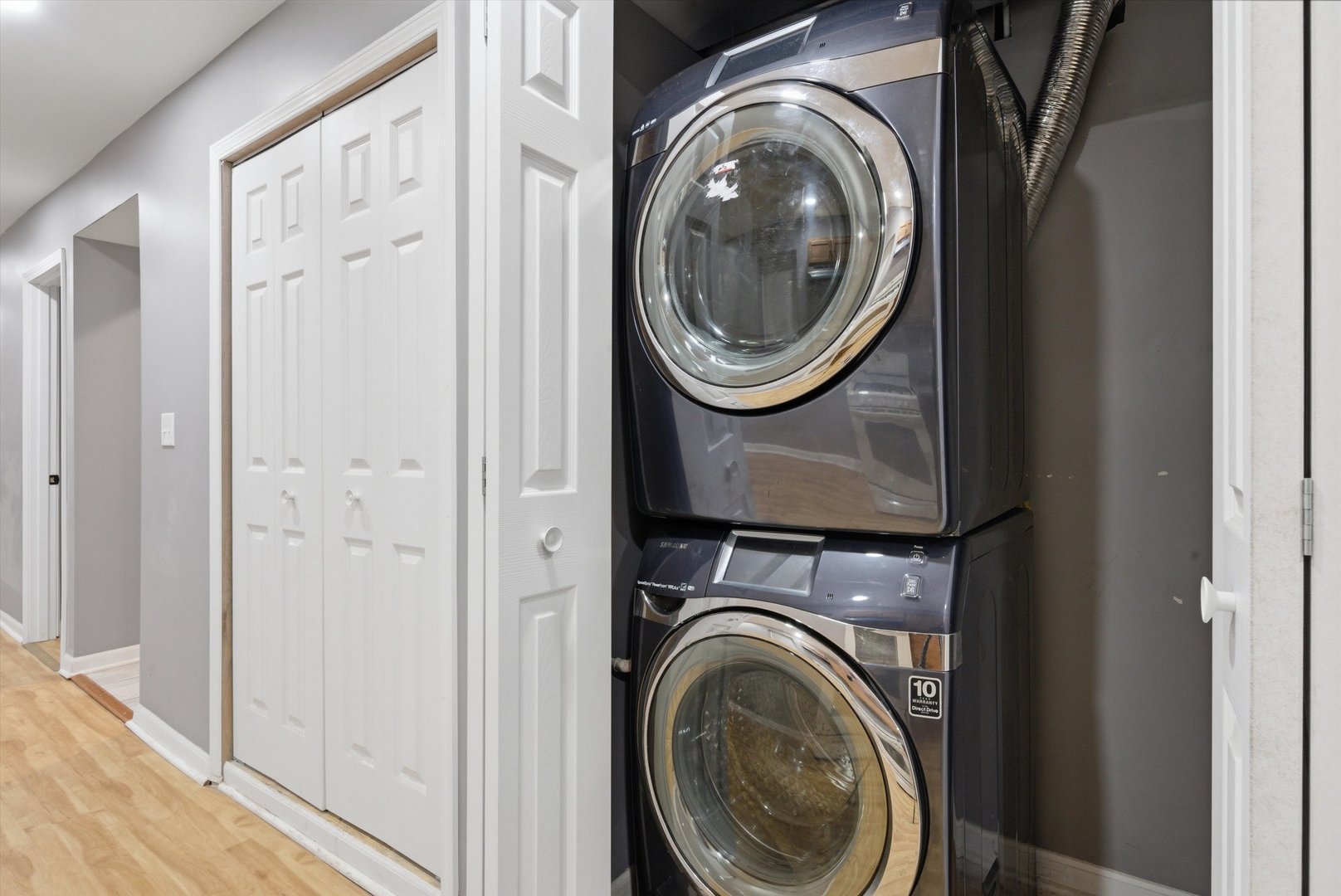 7828 South Escanaba Avenue Chicago, IL 60649 - Photo 31 of 41 a view of a hallway with washer and dryer