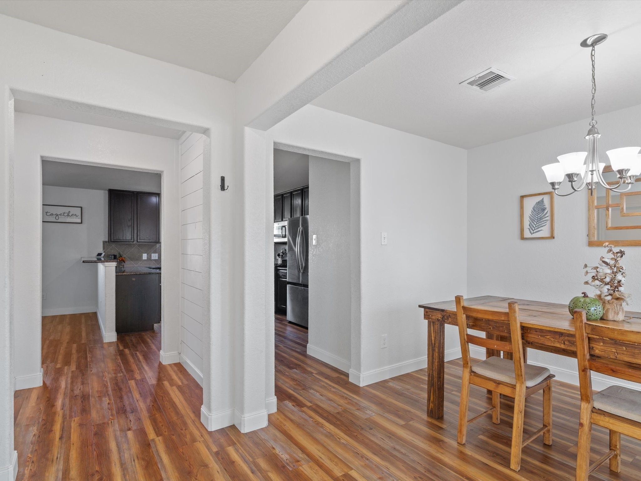 2535 Zephyr Lane Rosenberg, TX 77471 - Photo 12 of 40 a view of a dining room with furniture and wooden floor