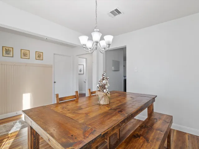 a bathroom with a double vanity sink mirror and toilet