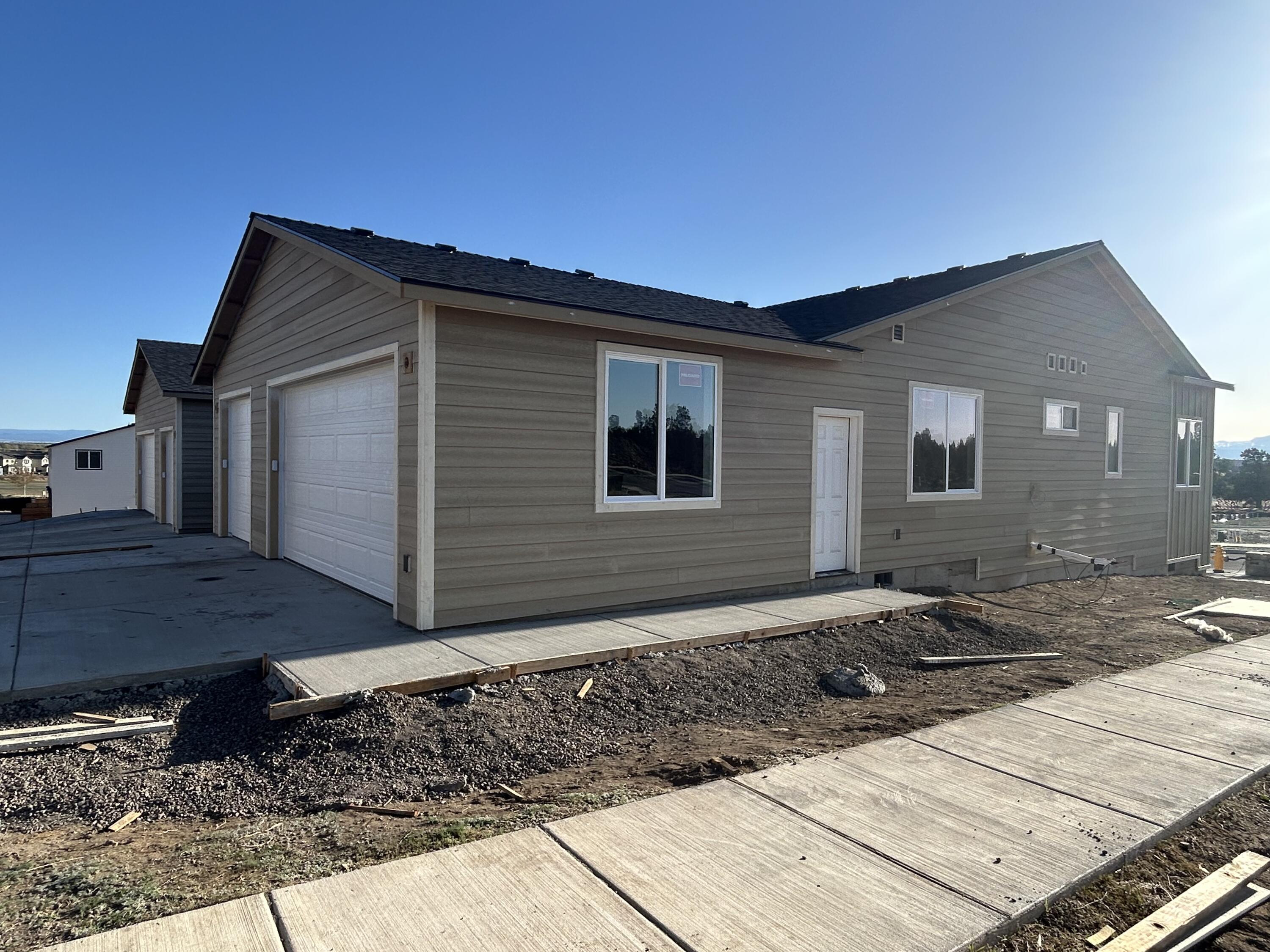 3910 Southwest 39th Street, Unit LOT 40 Redmond, OR 97756 - Photo 6 of 26 Side view garage