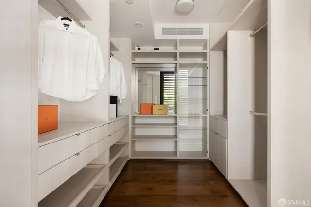 a view of walk in closet and window