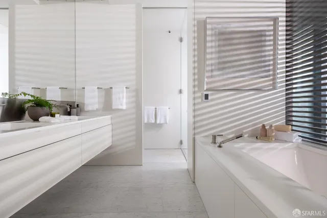 a bathroom with a bathtub and a sink