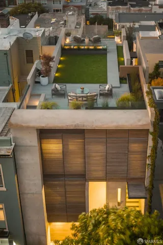 a view of patio with a table and chairs and potted plants