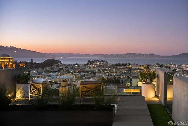 a view of a chairs and table in patio