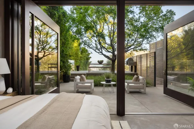 a balcony view with a couch and the view of outdoor space