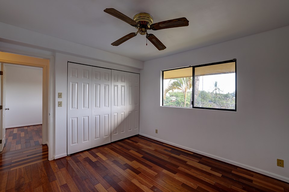 1450 South Kihei Road, Unit C203 Kihei, HI 96753 - Photo 11 of 21 wooden floor in an empty room with a window