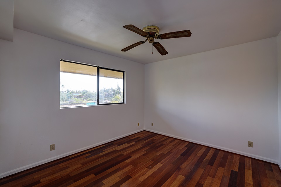 1450 South Kihei Road, Unit C203 Kihei, HI 96753 - Photo 12 of 21 a view of empty room with wooden floor and fan