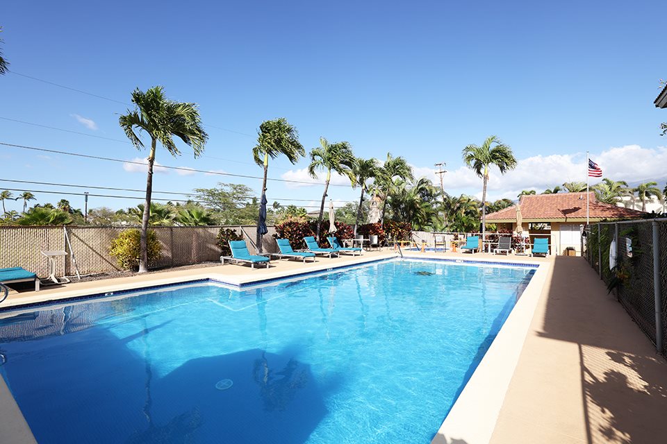 1450 South Kihei Road, Unit C203 Kihei, HI 96753 - Photo 20 of 21 a view of a swimming pool with a table and chairs