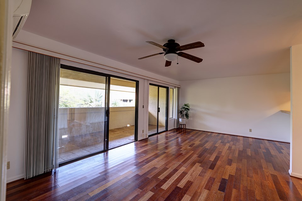 1450 South Kihei Road, Unit C203 Kihei, HI 96753 - Photo 2 of 21 an empty room with wooden floor and windows