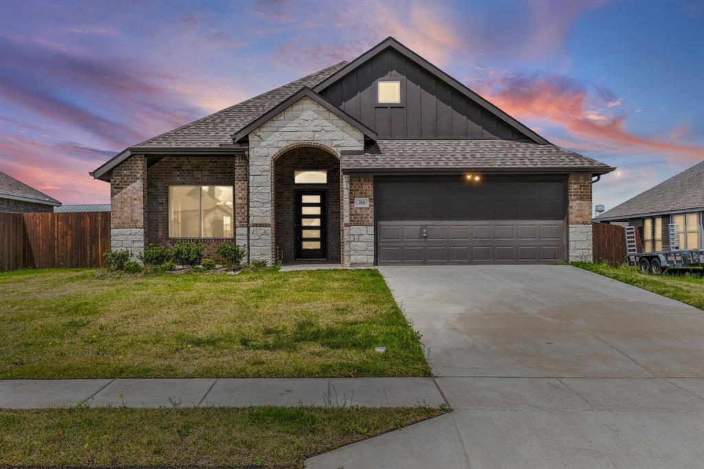 314 Pennington Road Josephine, TX 75173 - Photo 1 of 37 a front view of a house with garden