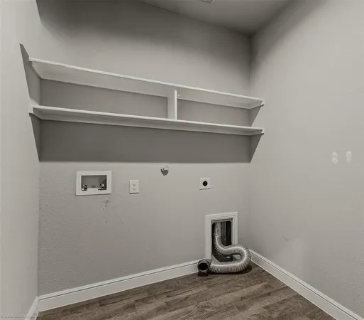 a view of storage and utility room with wooden floor