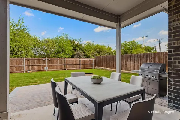 a view of a chairs and table in the patio