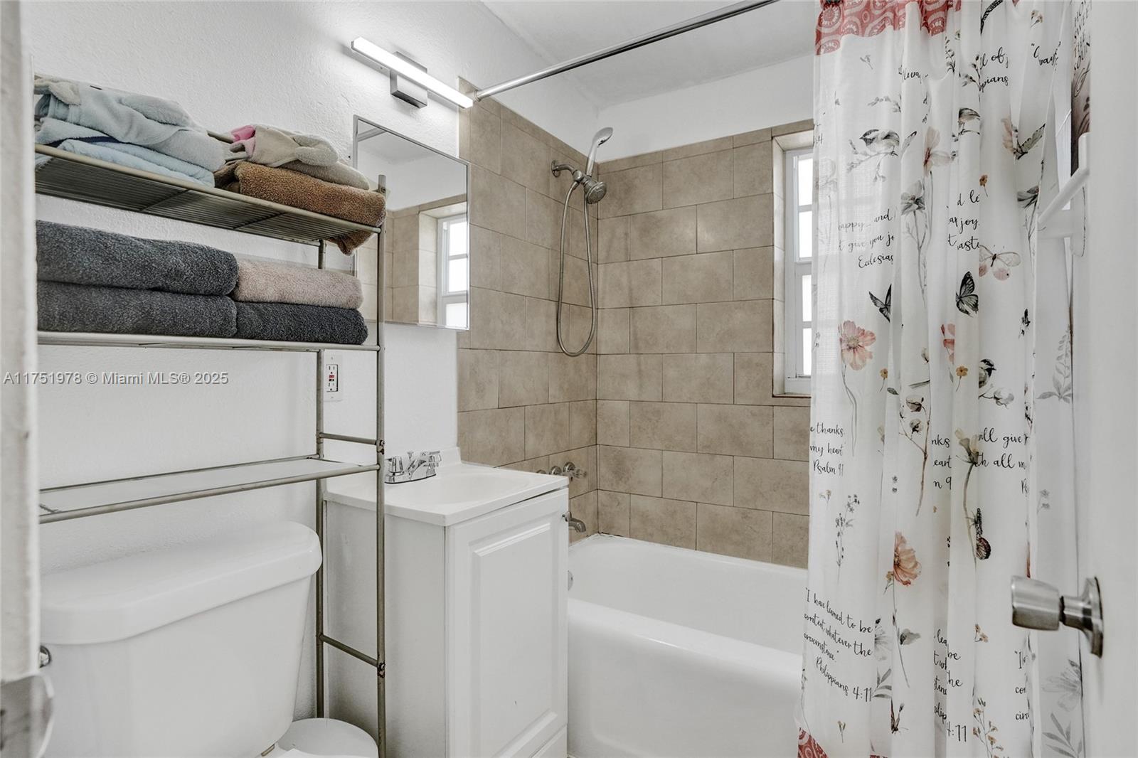 2091 Rutland Street Opa-Locka, FL 33054 - Photo 8 of 25 a bathroom with a bathtub and shower