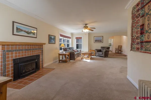 a living room with furniture and a fireplace