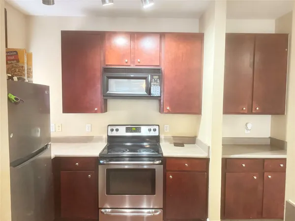 a kitchen with a stove and a microwave