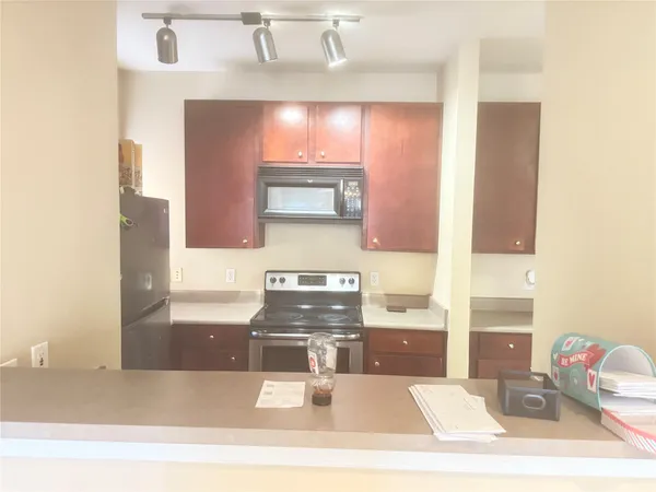 a bathroom with a bathtub sink and mirror