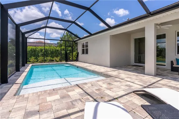 a view of backyard with a patio