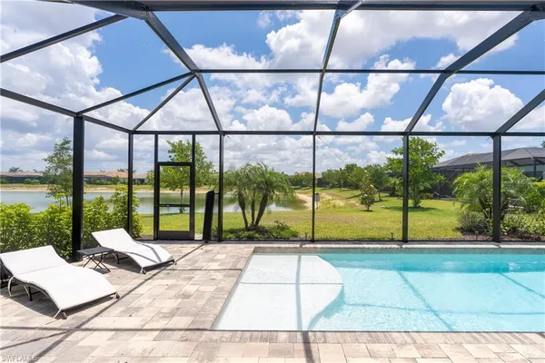 a view of swimming pool with a patio