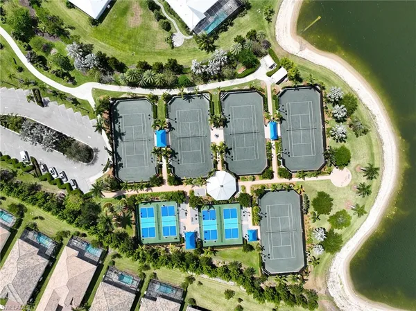 an aerial view of a house with a swimming pool