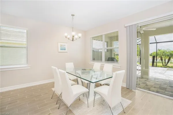 a dining room with furniture and window