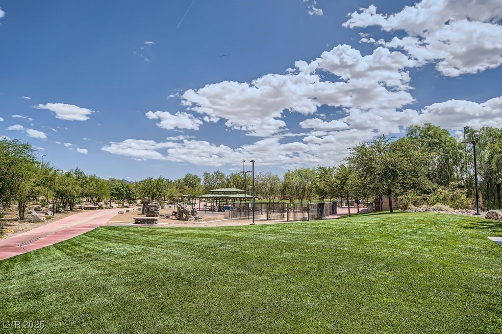 591 Fox Chase Street Henderson, NV 89015 - Photo 16 of 22 View of home's community with a yard, a patio, a gazebo, and view of scattered trees