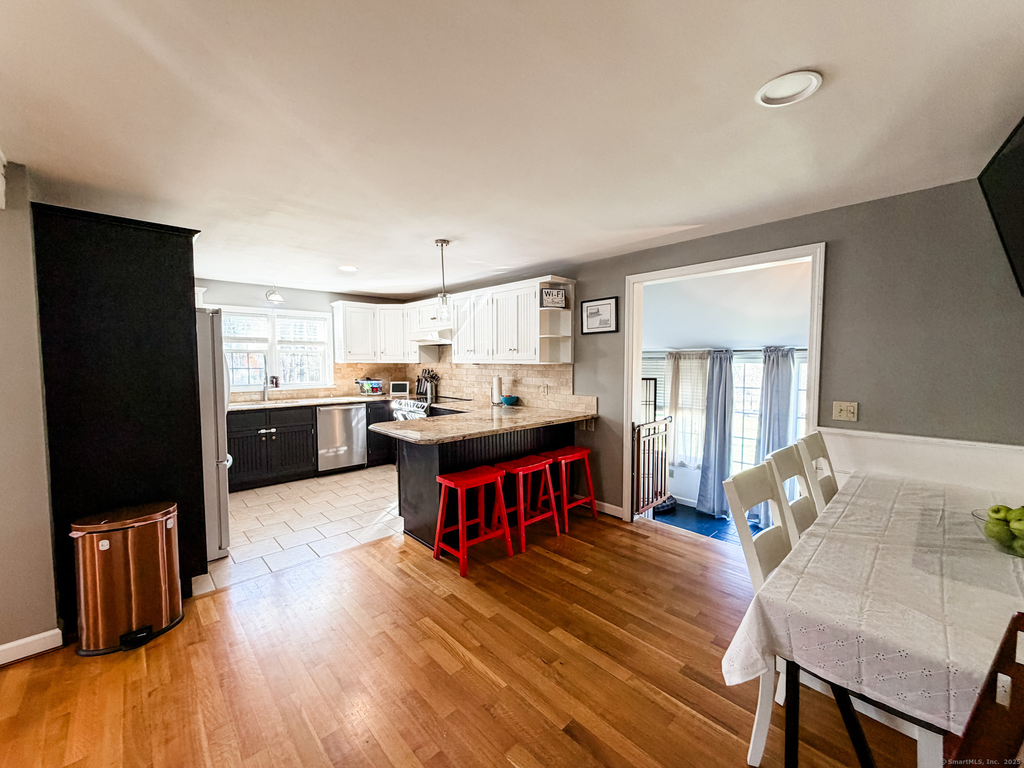 4 Jerusalem Road Windham, CT 06280 - Photo 16 of 37 a living room with stainless steel appliances kitchen island granite countertop furniture a kitchen island a stove and a refrigerator