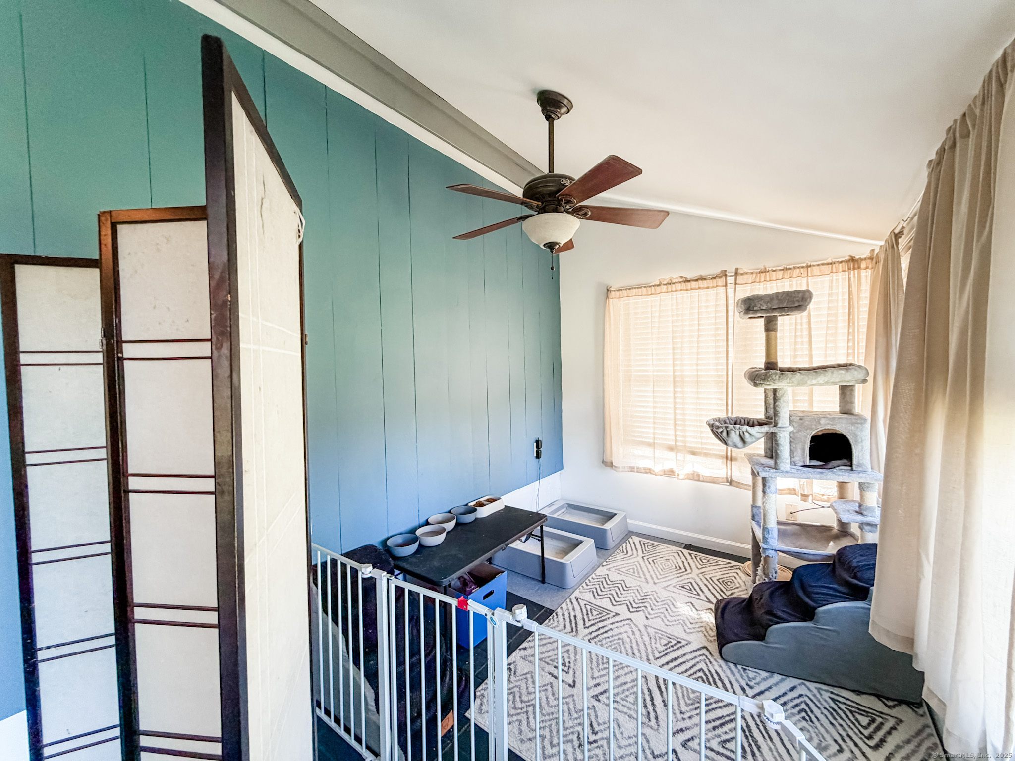 4 Jerusalem Road Windham, CT 06280 - Photo 19 of 37 a bedroom with a bed and a chandelier