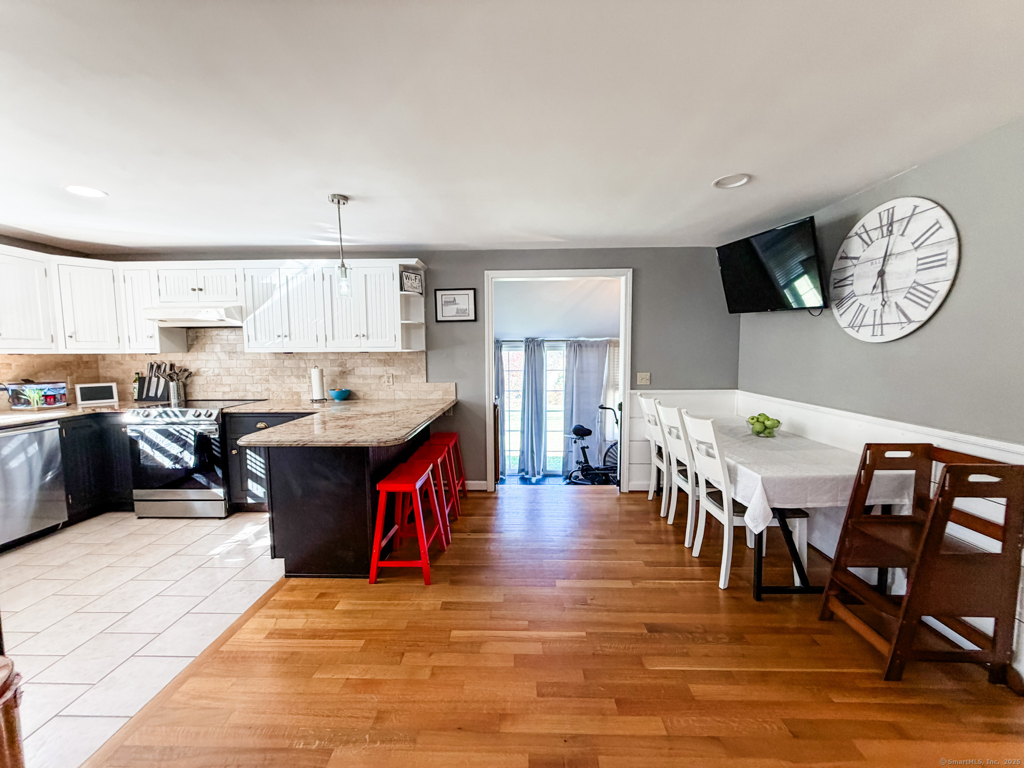 4 Jerusalem Road Windham, CT 06280 - Photo 2 of 37 a large kitchen with a large counter space a sink appliances and a dining table