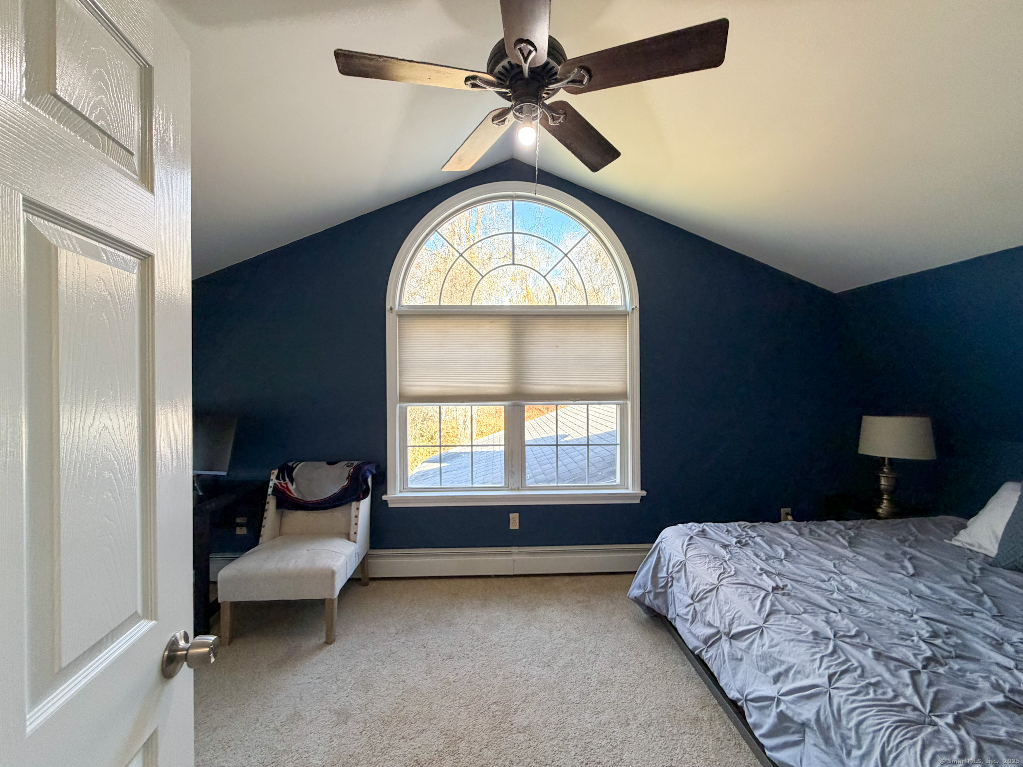 4 Jerusalem Road Windham, CT 06280 - Photo 25 of 37 a bedroom with a bed and a chandelier