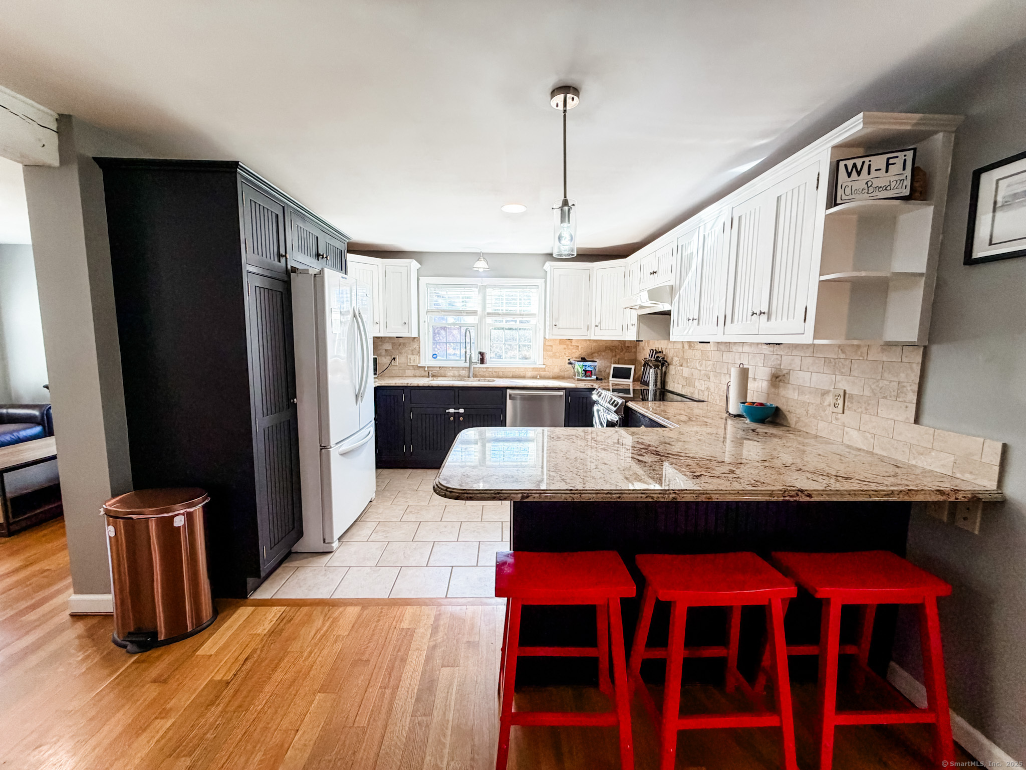 4 Jerusalem Road Windham, CT 06280 - Photo 4 of 37 a kitchen with stainless steel appliances kitchen island granite countertop a sink stove and refrigerator