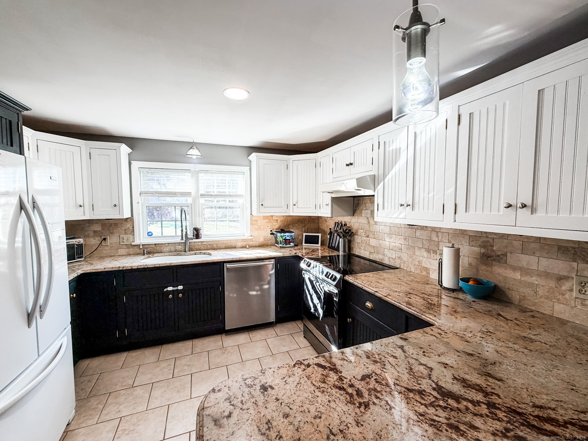 4 Jerusalem Road Windham, CT 06280 - Photo 6 of 37 a kitchen with stainless steel appliances granite countertop a refrigerator sink and cabinets
