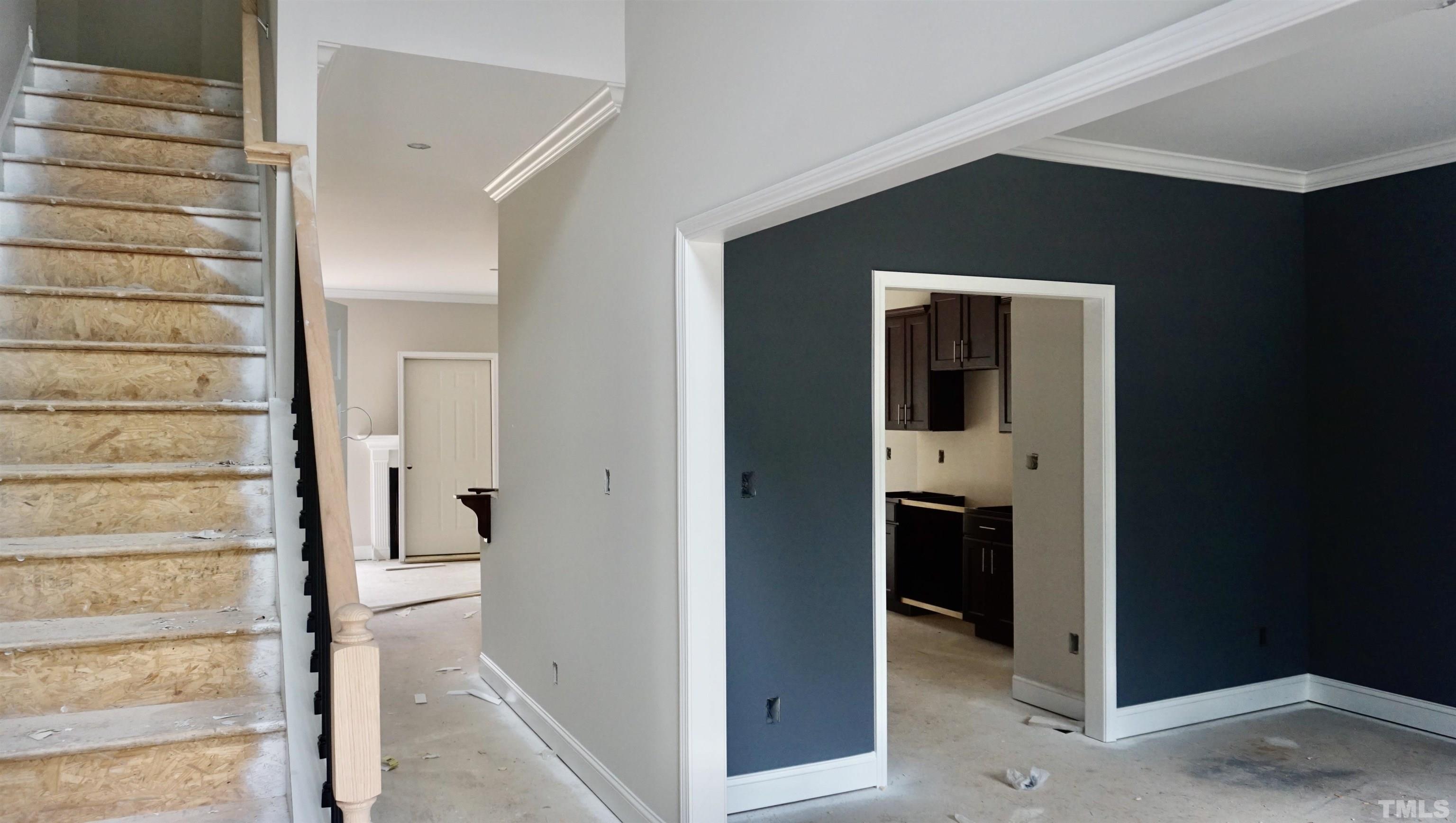810 Mulberry Road Spring Hope, NC 27882 - Photo 1 of 25 a view of a hallway with wooden cabinets and staircase