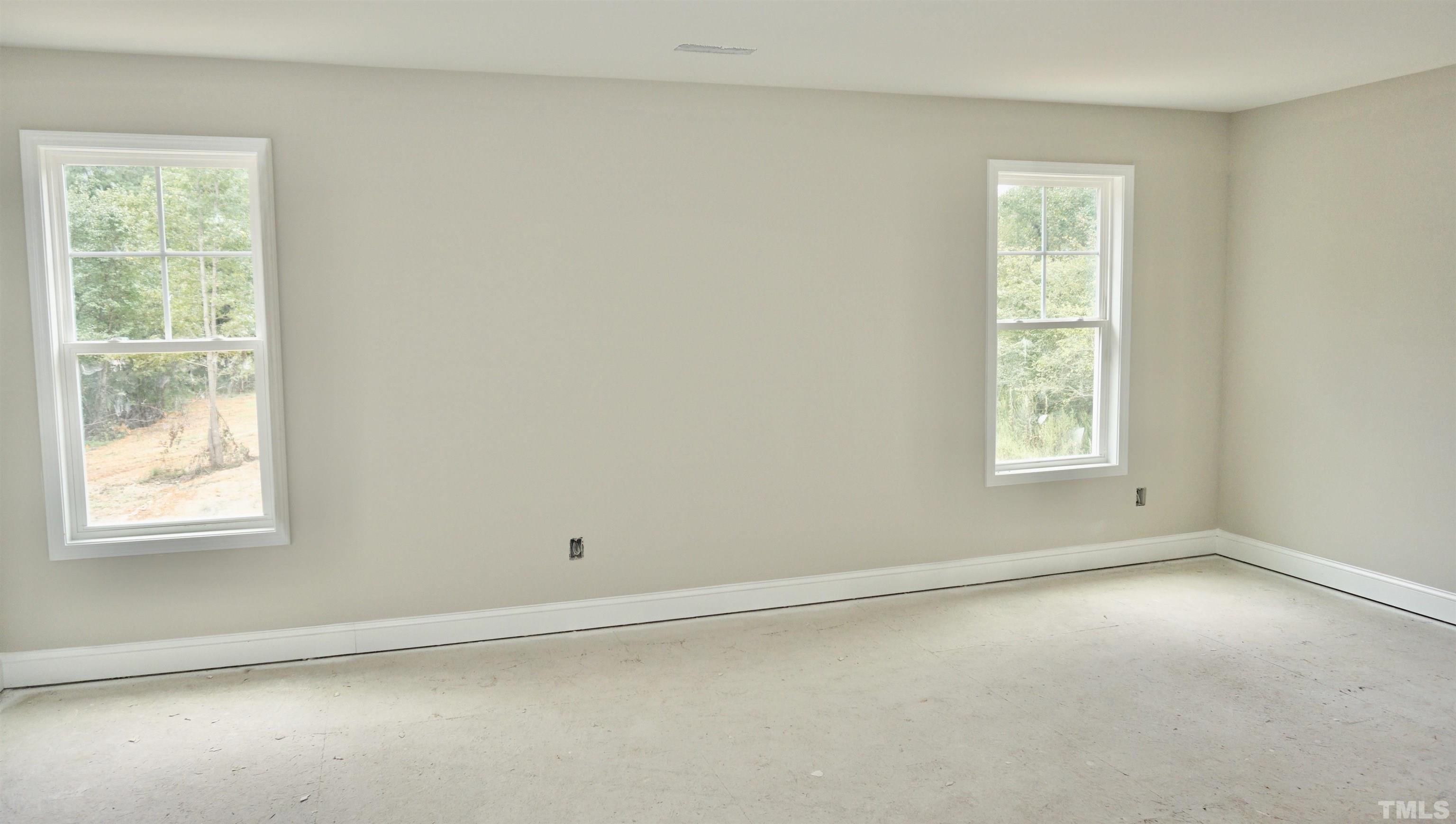 810 Mulberry Road Spring Hope, NC 27882 - Photo 13 of 25 an empty room with a window