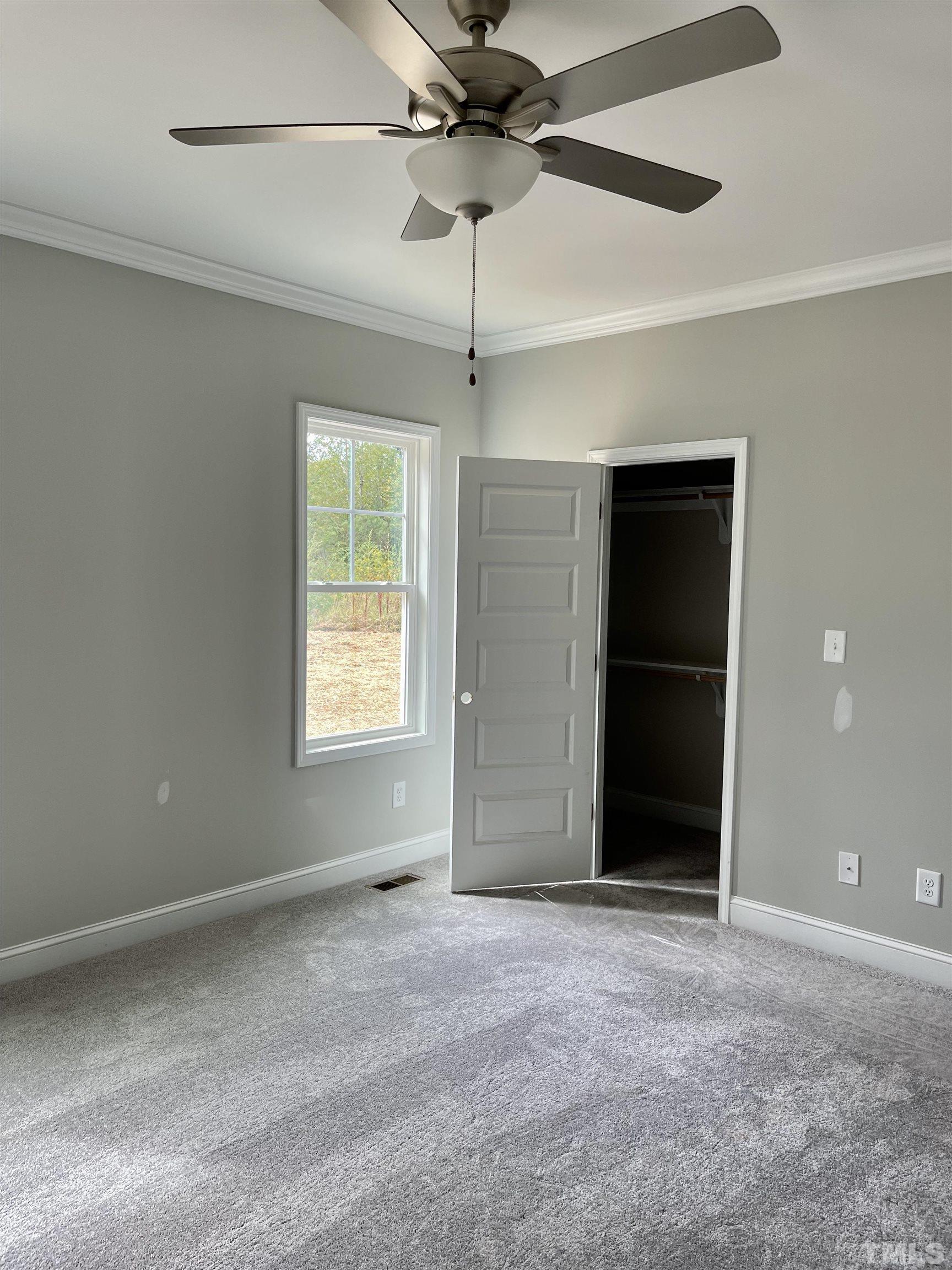 810 Mulberry Road Spring Hope, NC 27882 - Photo 19 of 25 a view of an empty room with a window