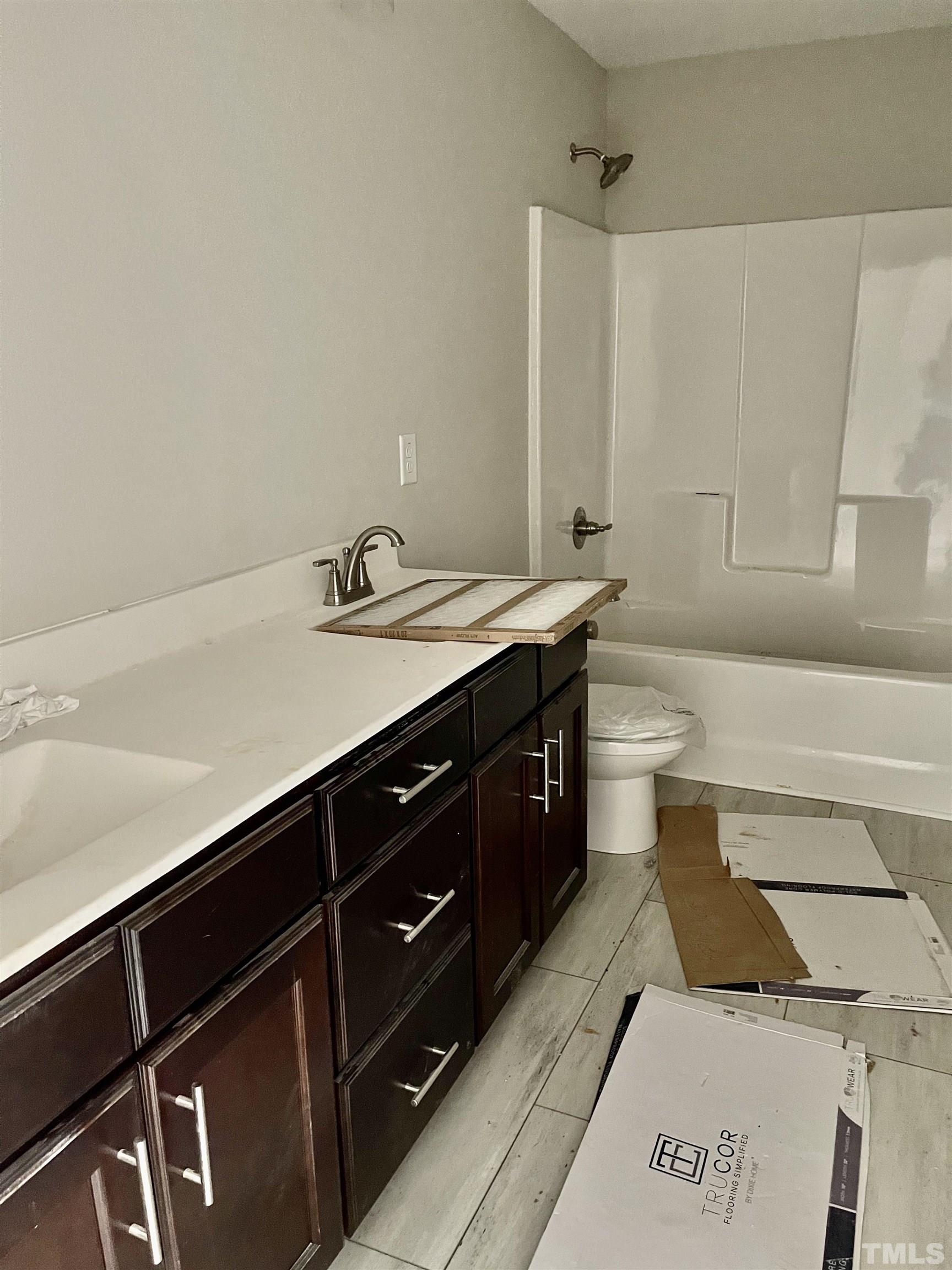 810 Mulberry Road Spring Hope, NC 27882 - Photo 21 of 25 a bathroom with a sink and a mirror
