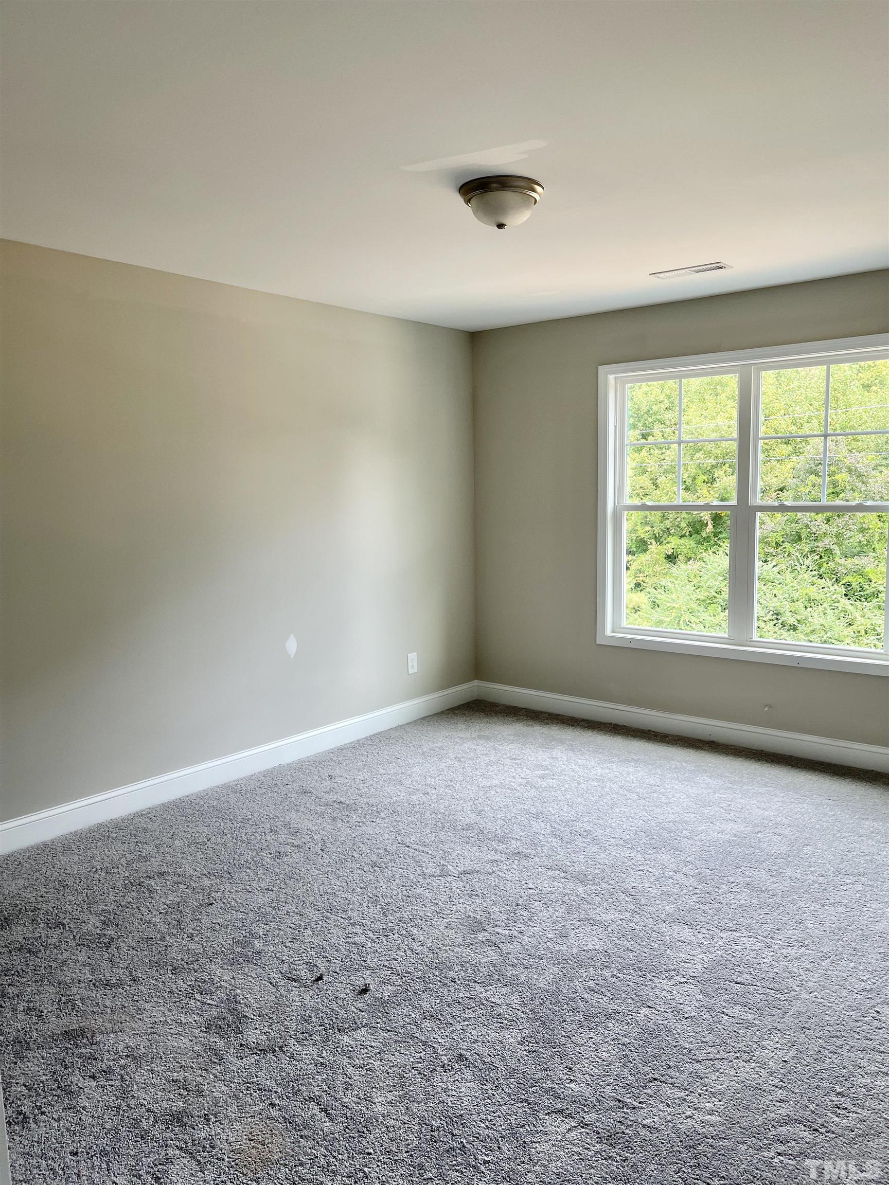 810 Mulberry Road Spring Hope, NC 27882 - Photo 22 of 25 an empty room with a window