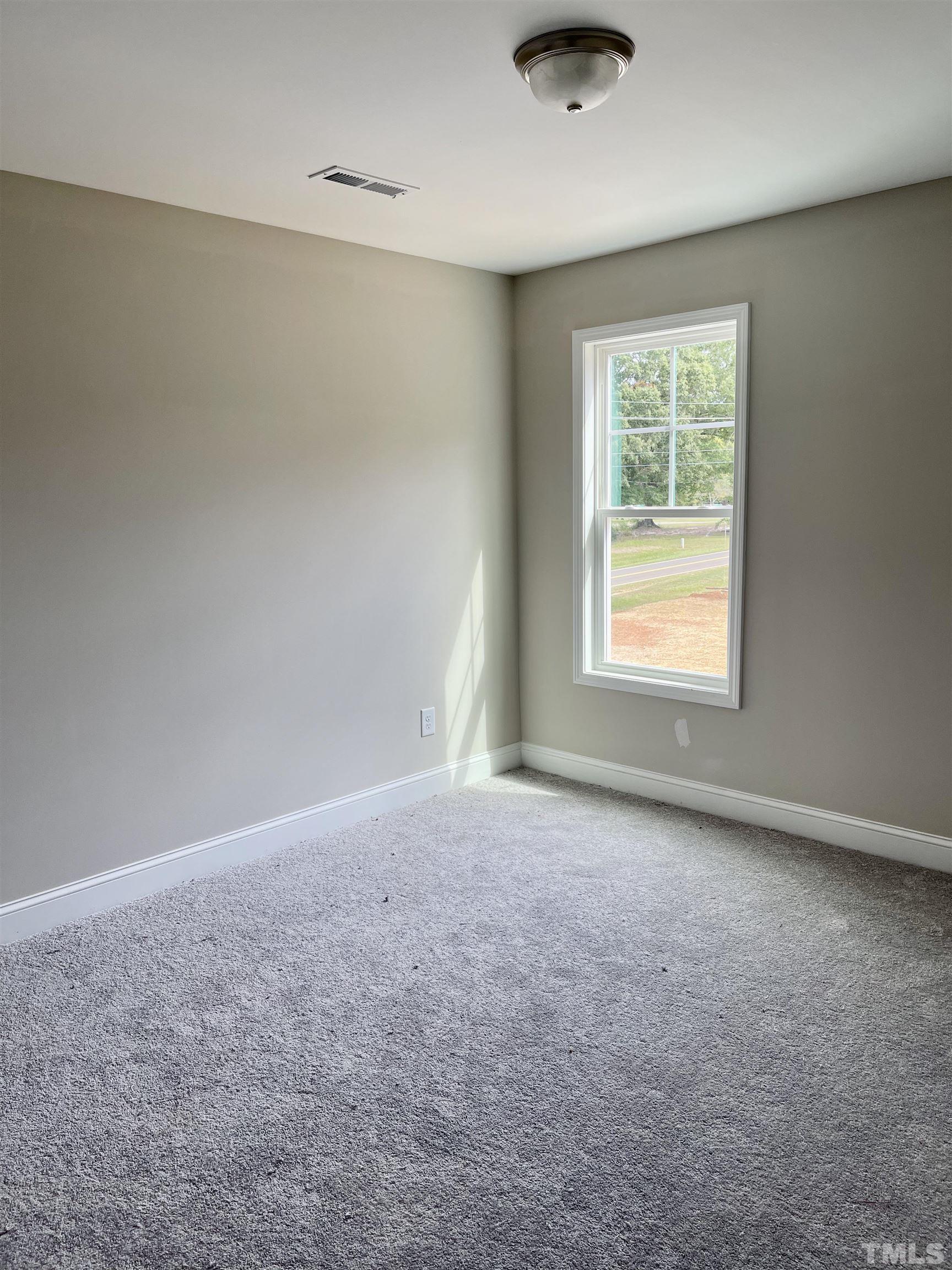 810 Mulberry Road Spring Hope, NC 27882 - Photo 23 of 25 an empty room with windows