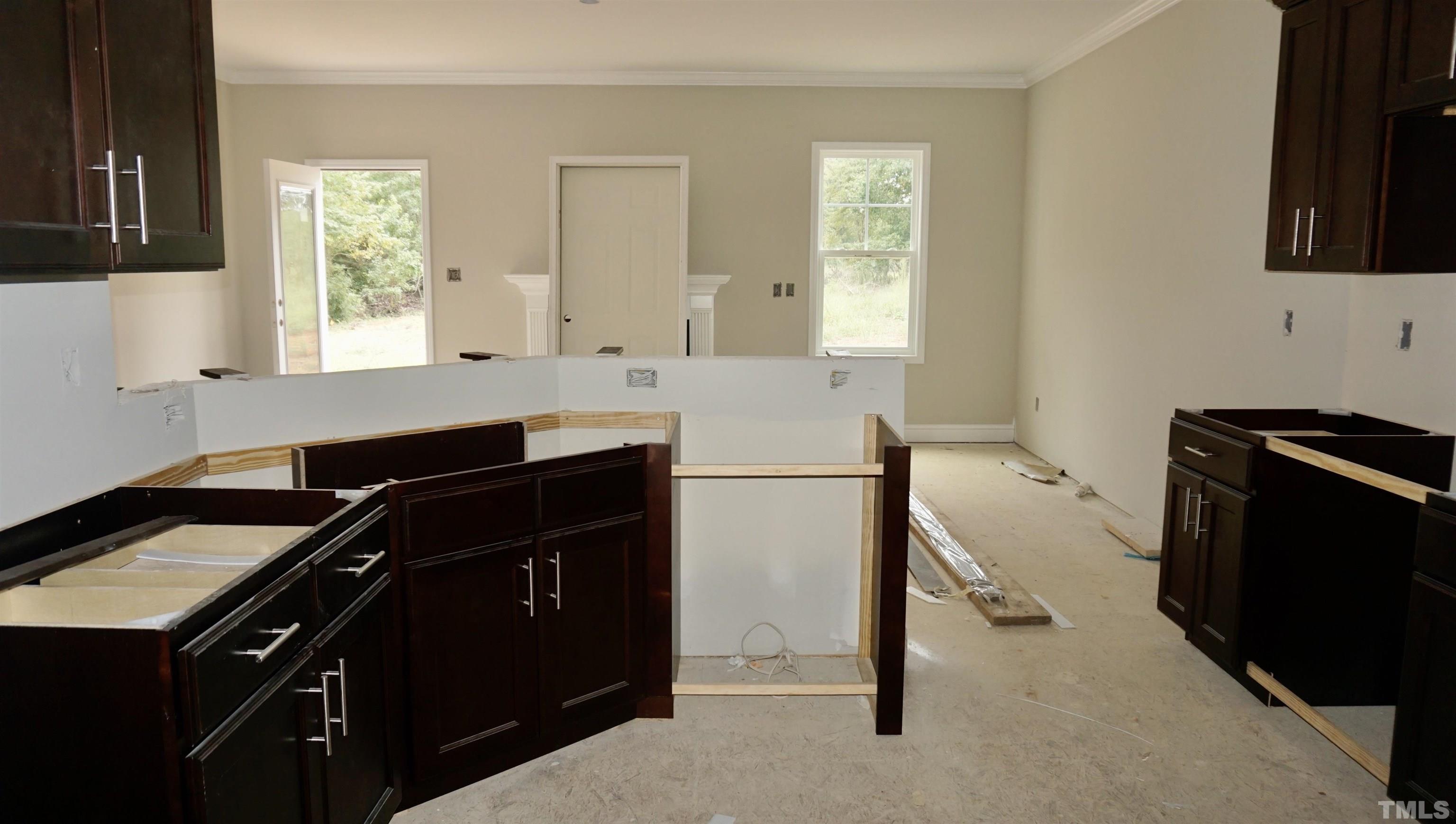 810 Mulberry Road Spring Hope, NC 27882 - Photo 4 of 25 a kitchen with a sink appliances and cabinets