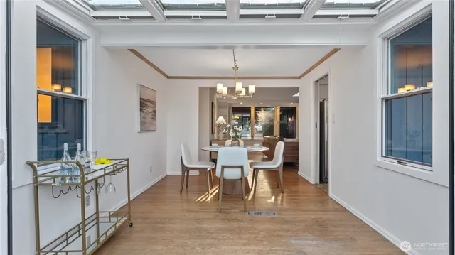 a view of a dining room with furniture window and wooden floor