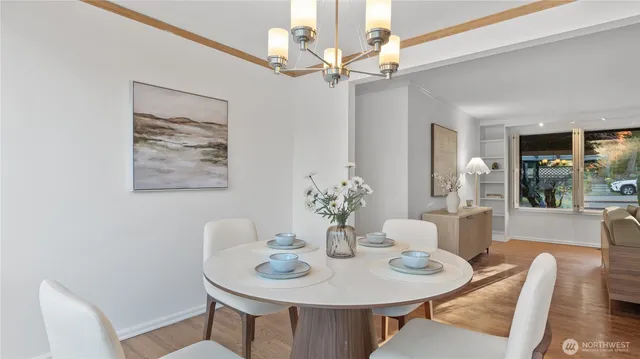 a view of a dining room with furniture and wooden floor