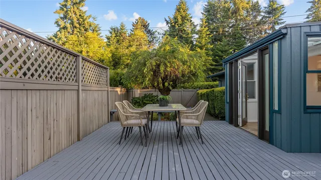 a view of backyard with a deck and wooden floor