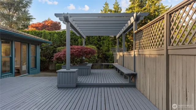 a view of backyard with patio