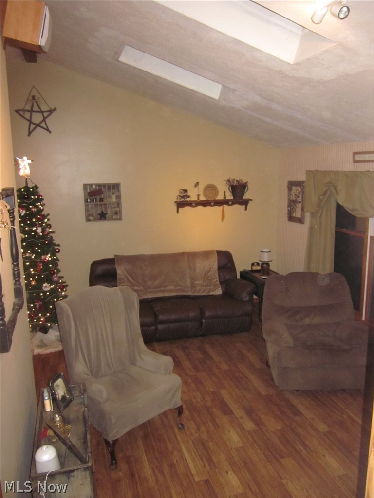 9605 Lowmiller Road Minerva, OH 44657 - Photo 5 of 18 Taken from hallway upstairs, living room with vaulted ceilings and skylights