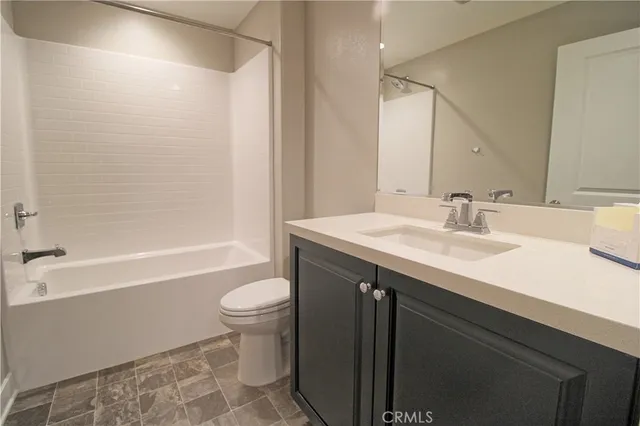 a bathroom with a sink a toilet and a bathtub