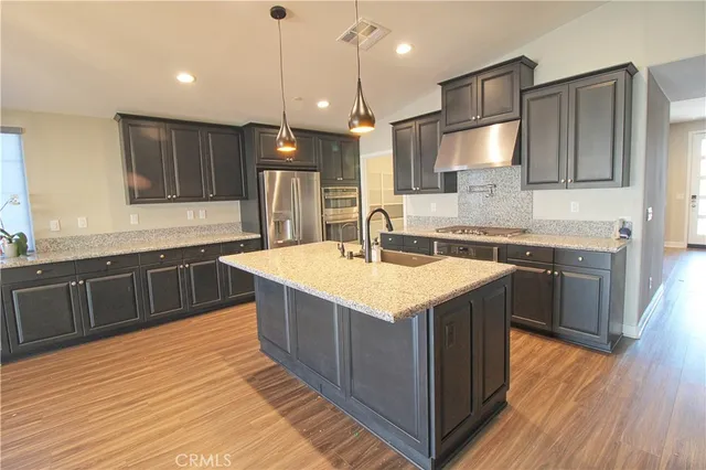 a kitchen with a sink and wooden cabinets