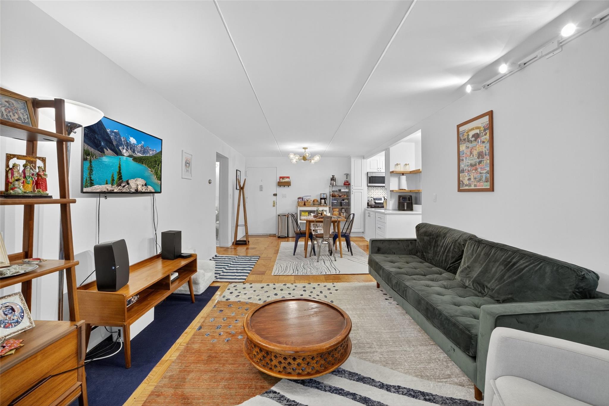 108 Sagamore Road, Unit 5F Tuckahoe, NY 10707 - Photo 18 of 33 Living area with a chandelier