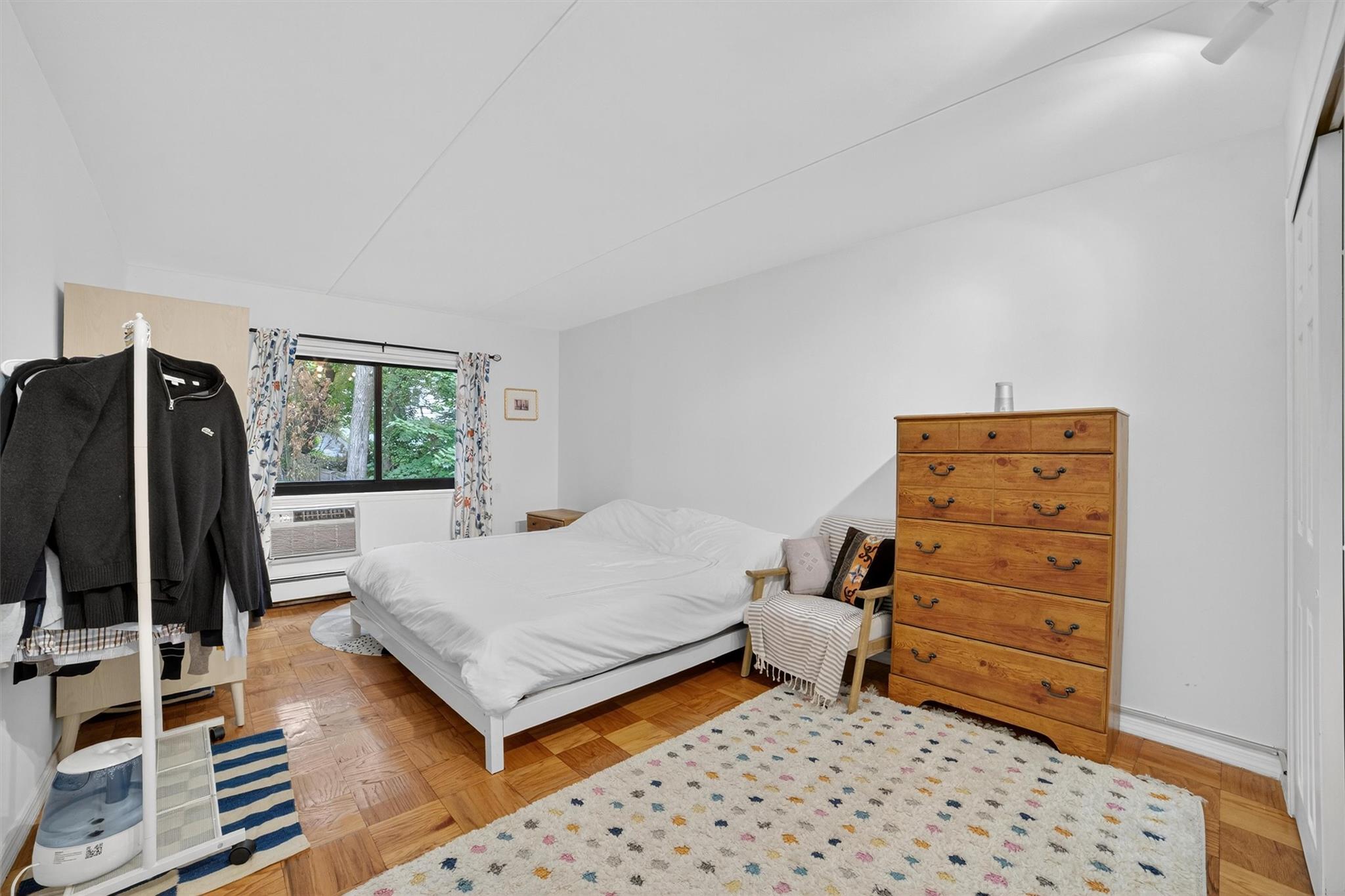 108 Sagamore Road, Unit 5F Tuckahoe, NY 10707 - Photo 24 of 33 Bedroom featuring baseboard heating and a wall unit AC