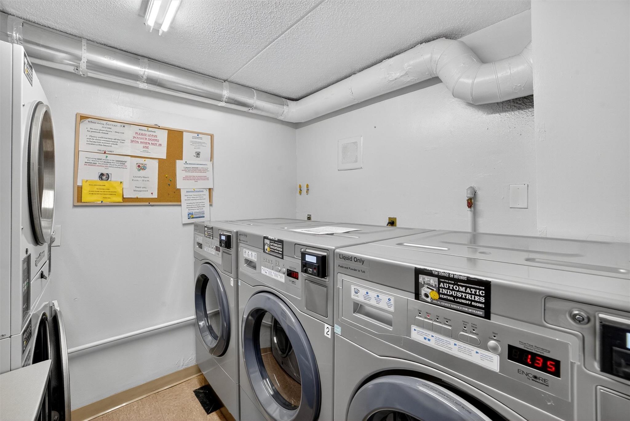 108 Sagamore Road, Unit 5F Tuckahoe, NY 10707 - Photo 29 of 33 Community laundry room featuring separate washer and dryer, a textured ceiling, and estacked washer and dryer