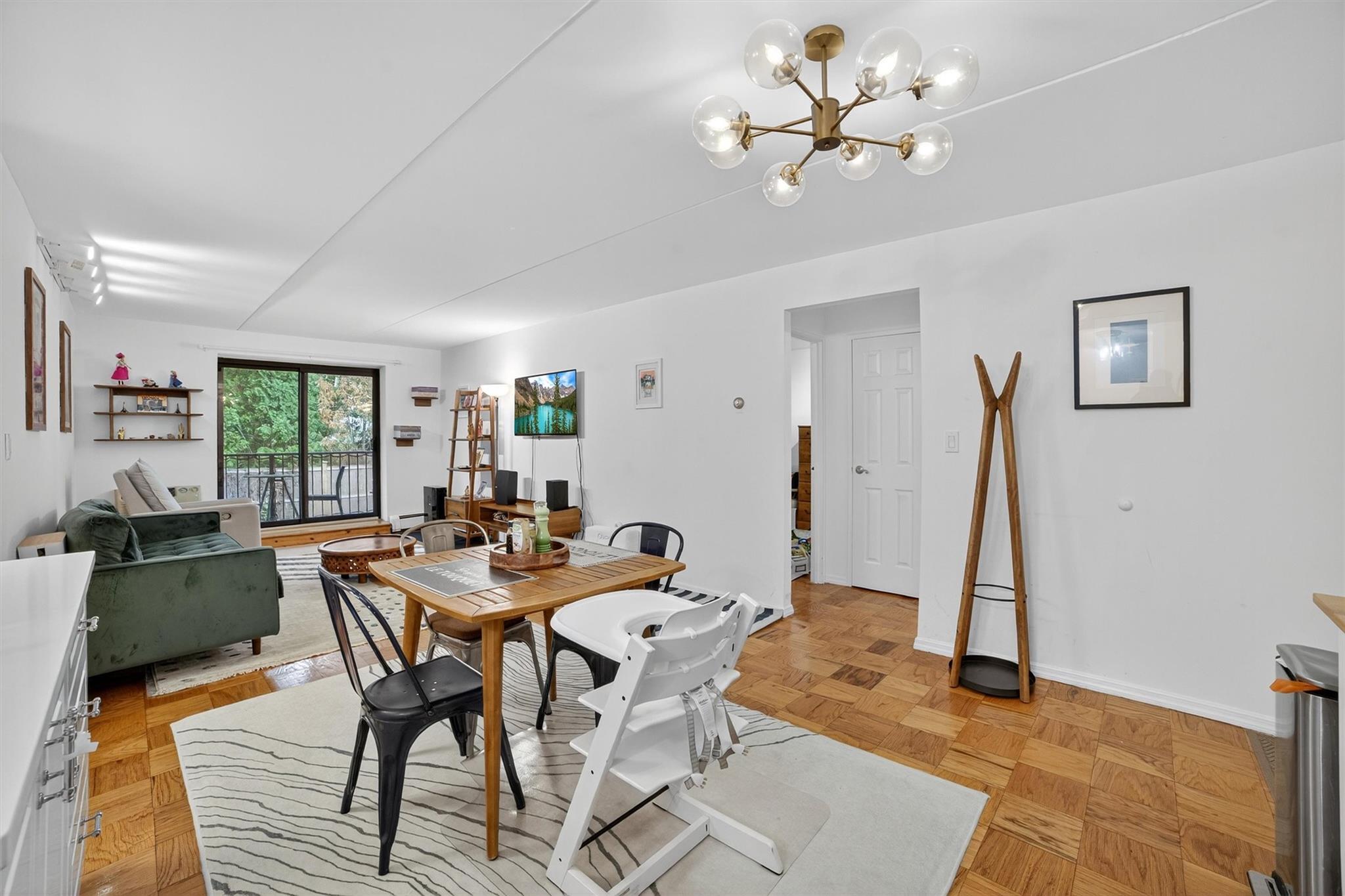 108 Sagamore Road, Unit 5F Tuckahoe, NY 10707 - Photo 9 of 33 Dining area featuring a chandelier and baseboards